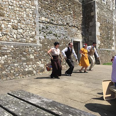 Cinque Ports Lindy Hoppers: Dover Castle World War 2 weekend - May 2018 - Dapper Dru, Sugarfoot Sophie, Doodlebug Donna and Tall Paul street dancing/busking performing the Savoy Shim Sham - Photo by Sarah Haines