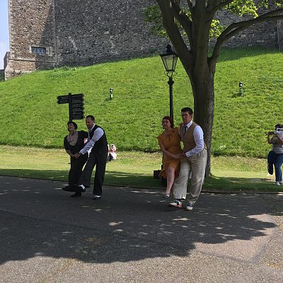 Cinque Ports Lindy Hoppers: Dover Castle World War 2 weekend - May 2018 - Dapper Dru, Sugarfoot Sophie, Doodlebug Donna and Tall Paul street dancing/busking performing the SaOpus One routine - Photo by Sarah Haines