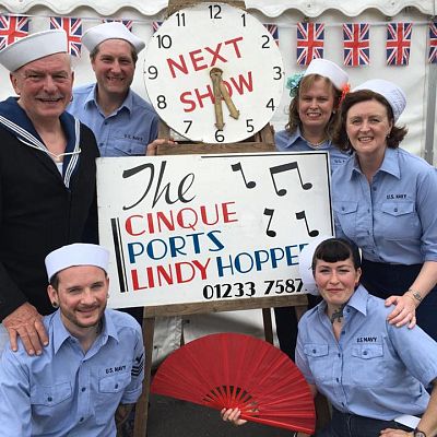 Cinque Ports Lindy Hoppers: Tenterden KESR 1940s Steam weekend May 2016 - Messing about in Deck Sailor outfits: Jim & Jenny, Dapper Dru & Sugarfoot Sophie, Gypsy John & Krazy Karen posing with the legendary CPLH clock